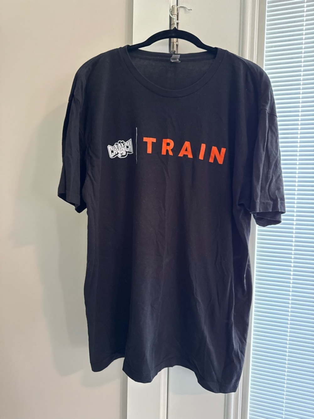 Crunch Gym Next Level Apparel Black Short-Sleeve Tee with Orange TRAIN Graphic